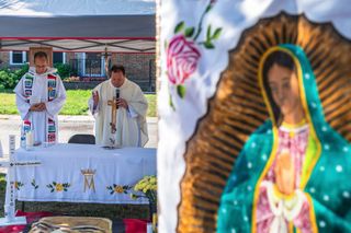 Two priests offering prayer, an out of focus view of Mary in the foreground.