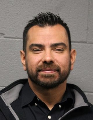 Mugshot of CPD detective Marco Torres